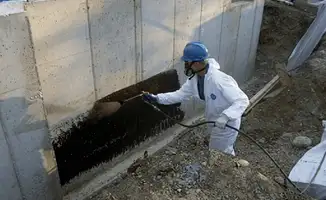 Professional waterproofing the exterior walls of the basement in Allentown, PA