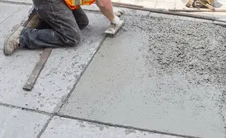 Professional repairing a concrete floor in Allentown, PA