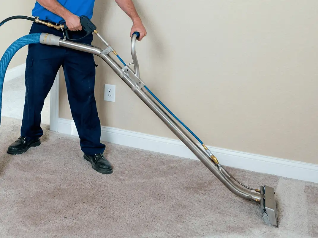 Professional operating a liquid removal machine on a carpeted floor in Allentown, PA
